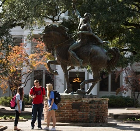 Students in front of statue on University of South Carolina's campus